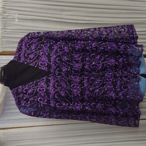 Channa 1X purple lace jacket on sheer black background with rhinestones.